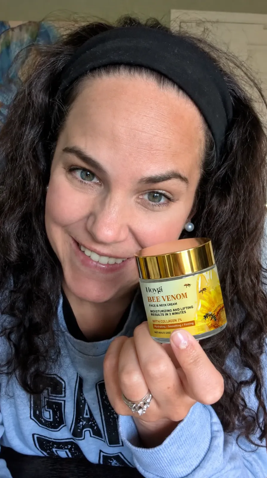 Customer holding Hoygi Bee Venom Lift Cream